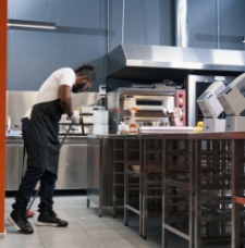 Cleaning the area around a table and chairs